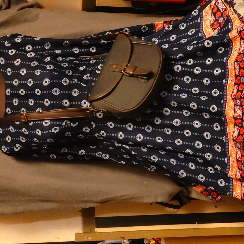 A small leather crossbody bag made by G.H. BASS AND CO.